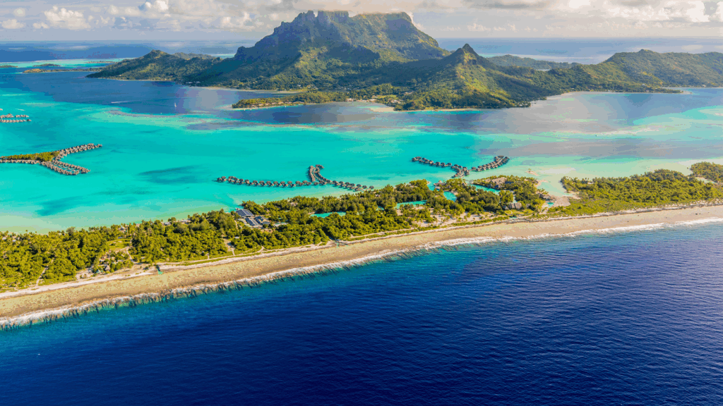Aerial view of Bora Bora, French Polynesia, its famous lagoon, Mount Otemanu, and the surrounding motus (islets)